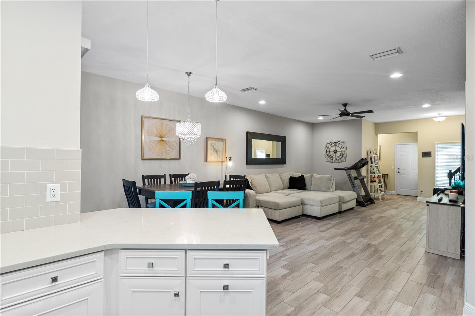 Gourmet Kitchen features stainless steel appliances, quartz counters, and 42" cabinetry