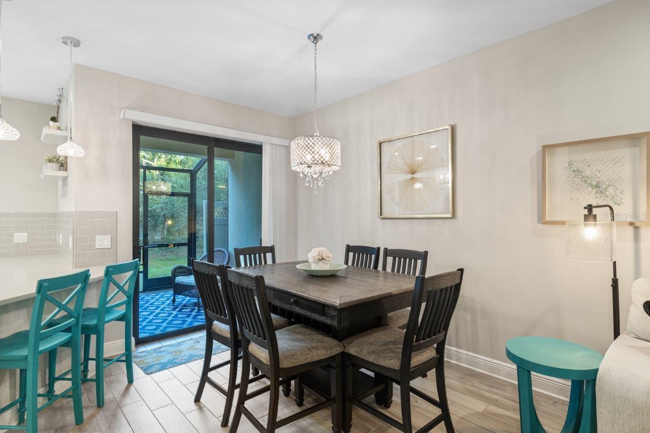 Dining room with direct access to the lanai featuring impact glass doors