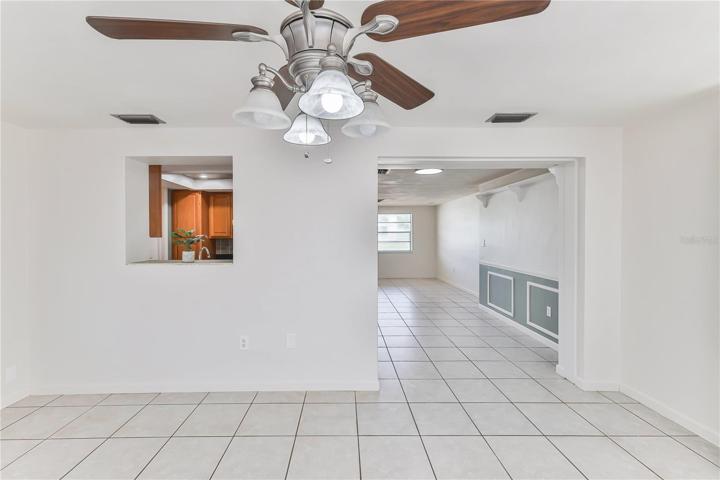 FAMILY ROOM LOOKING THROUGH TO DINING AREA AND KITCHEN