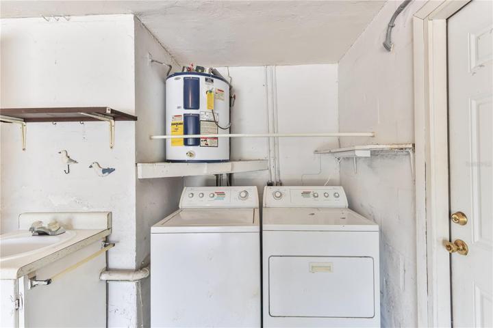 LAUNDRY AREA AND UTILTY TUB IN GARAGE