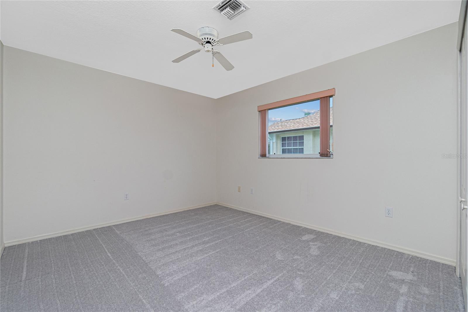 Bedroom #2 has carpeted flooring (approx. 2 year old), and a ceiling fan.