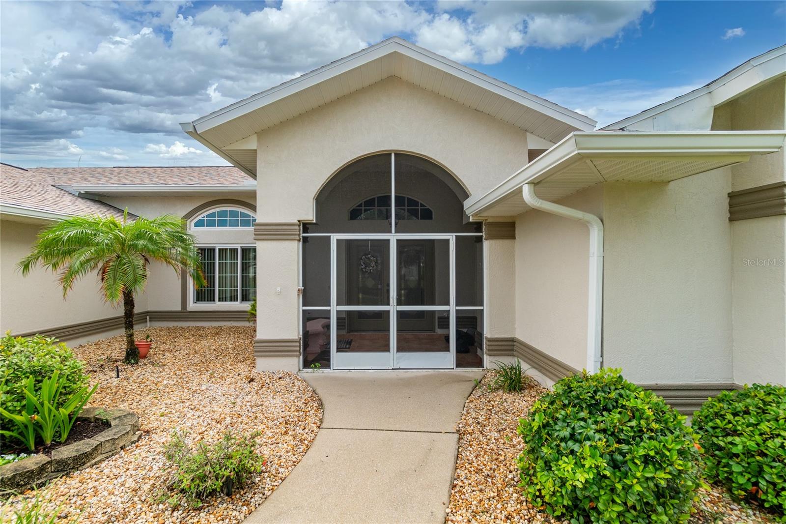 The front entry is screened and has tiled flooring.