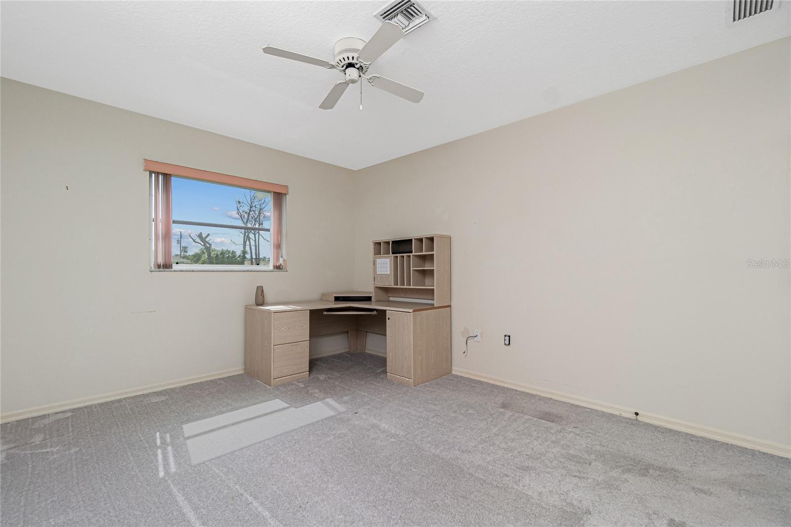 Bedroom #3 has carpeted flooring (approximately 2 years old) and a ceiling fan.