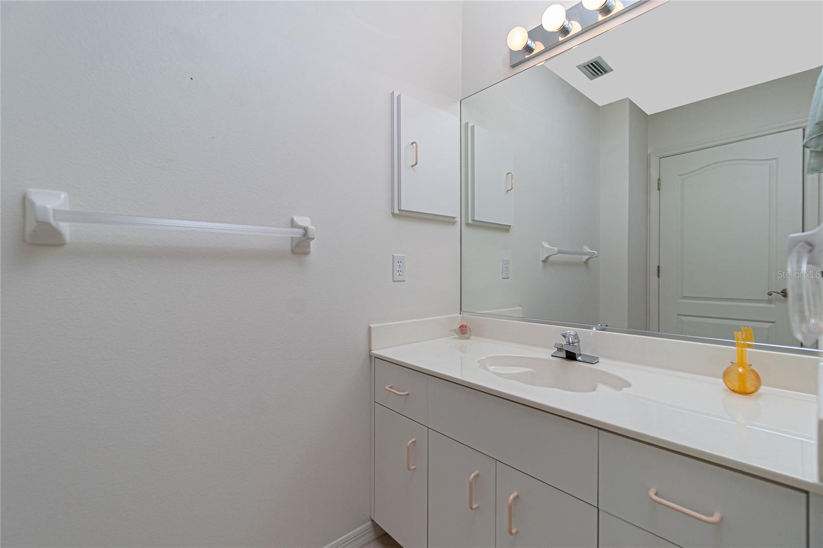 Bathroom #2 has a vanity/ cultured marble countertop and basin and linen closet.