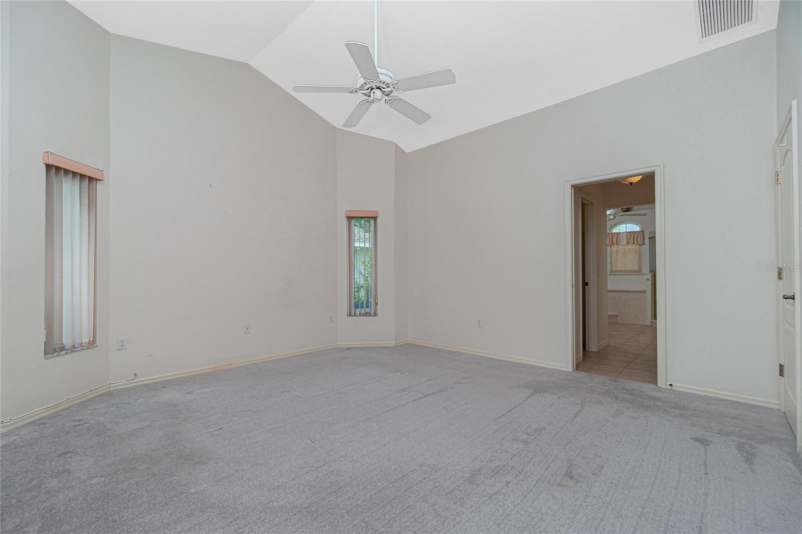 The master bedroom is very spacious, with ceiling fan and carpeted flooring (approx. 2 years old).
