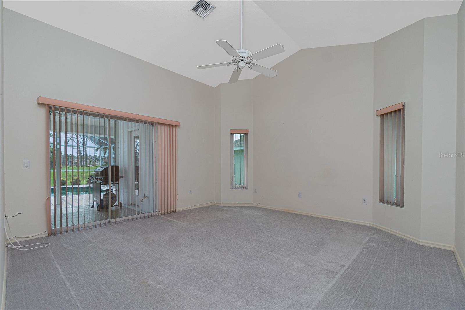 The master bedroom has its own sliding glass doors to the lanai.