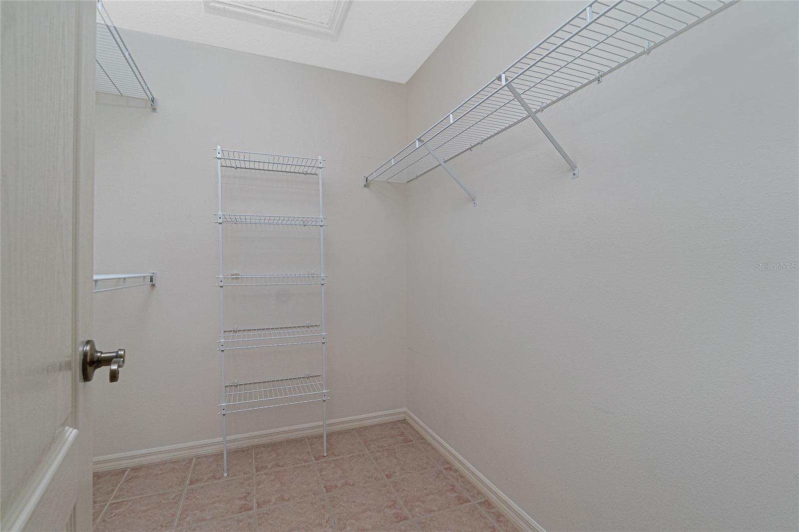 This is just one of two walk-in closets in the master bedroom.