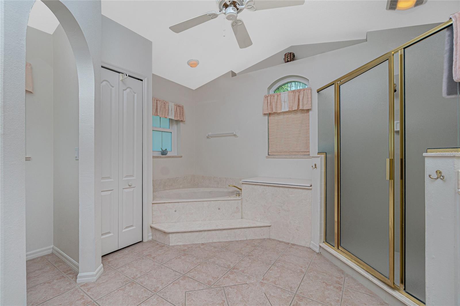 The master bathroom has a relaxing garden tub, linen closet and privacy commode.