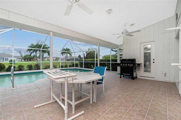 The lanai has tiled flooring, two ceiling fans and a lovely high ceiling.