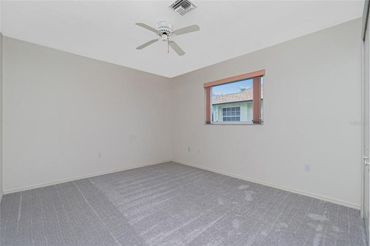 Bedroom #2 has carpeted flooring (approx. 2 year old), and a ceiling fan.