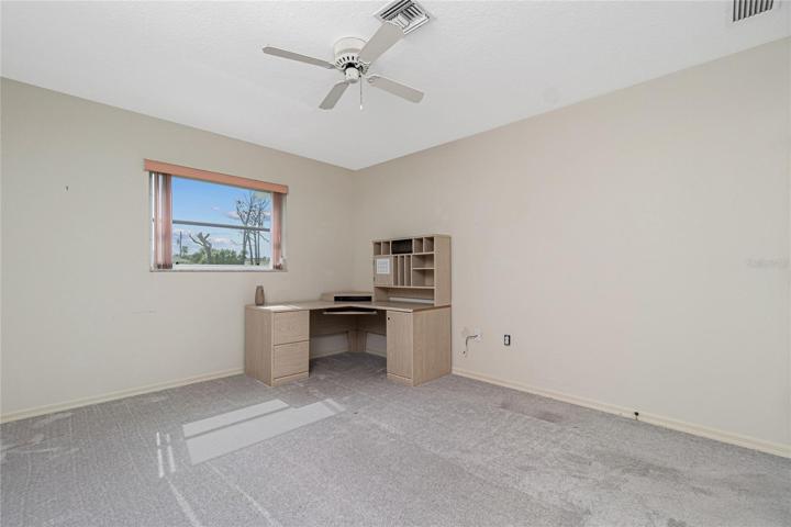 Bedroom #3 has carpeted flooring (approximately 2 years old) and a ceiling fan.