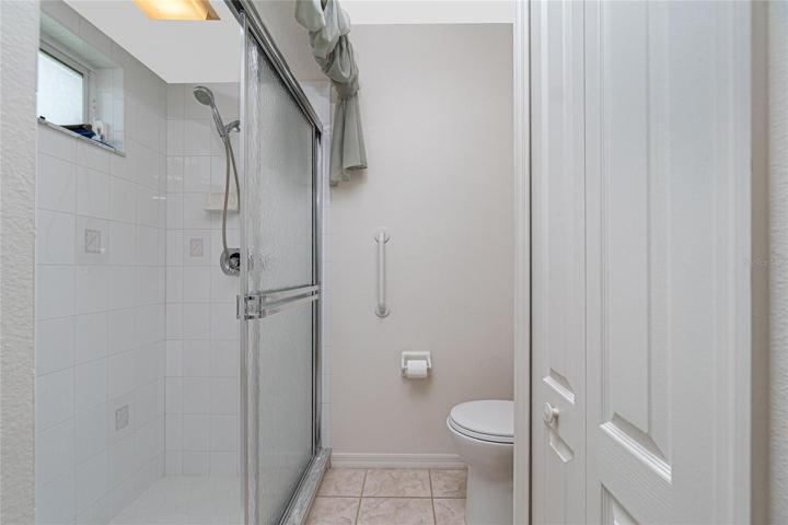 Bathroom #2 has a step-in shower with doors
