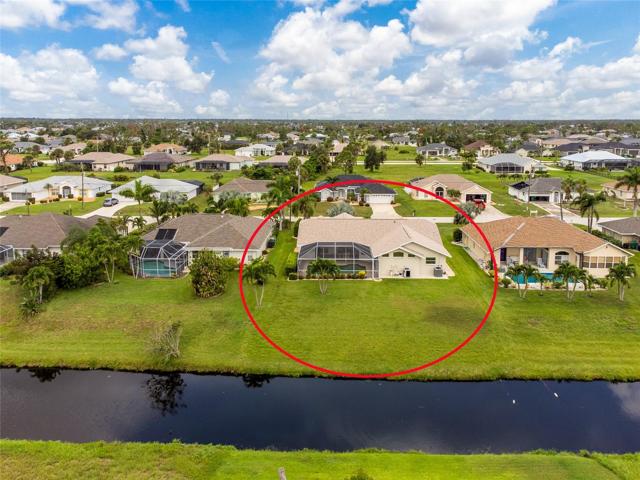 The back yard and back of the home overlook the freshwater canal.