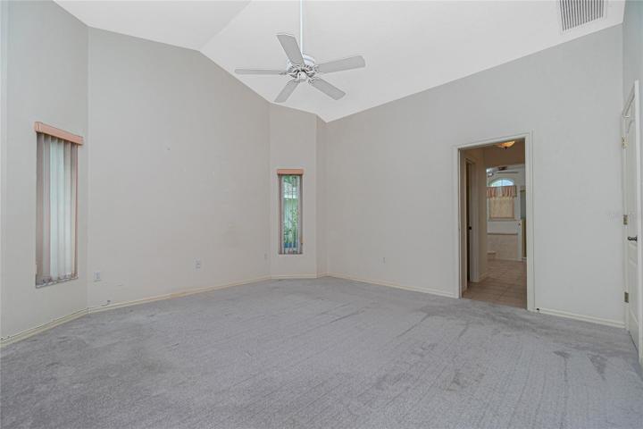 The master bedroom is very spacious, with ceiling fan and carpeted flooring (approx. 2 years old).