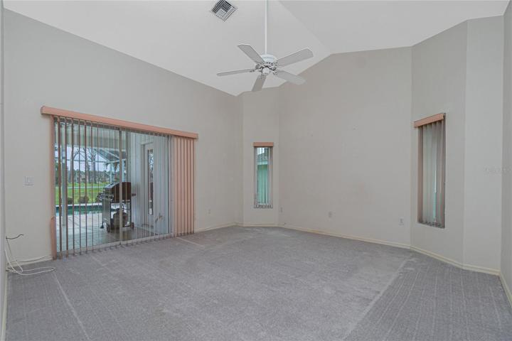 The master bedroom has its own sliding glass doors to the lanai.