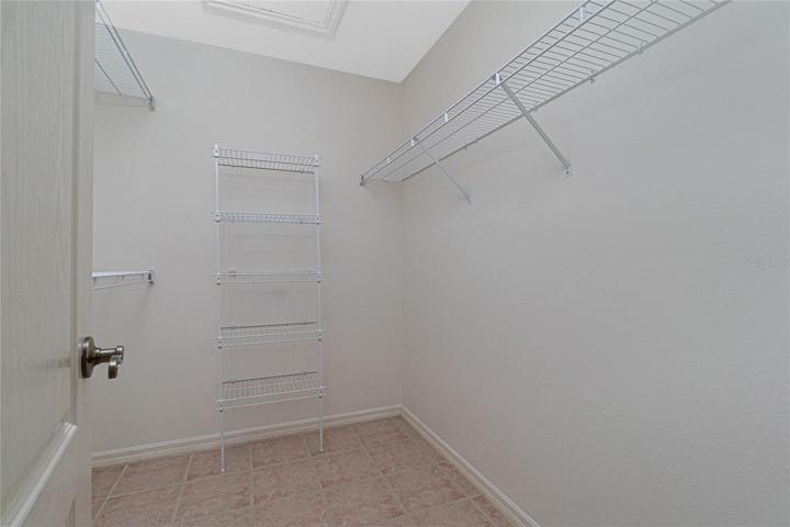 This is just one of two walk-in closets in the master bedroom.