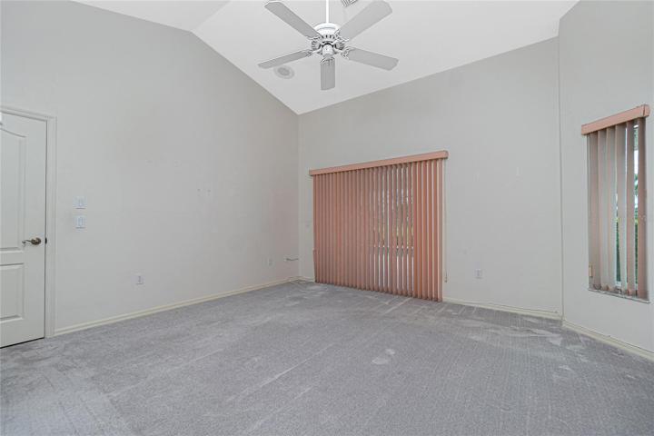 The master bedroom has beautiful high ceilings and a ceiling fan, and an en suite bathroom.