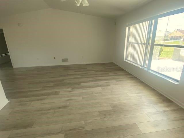 LIVING ROOM WITH LUXURY VINYL PLANK FLOORING
