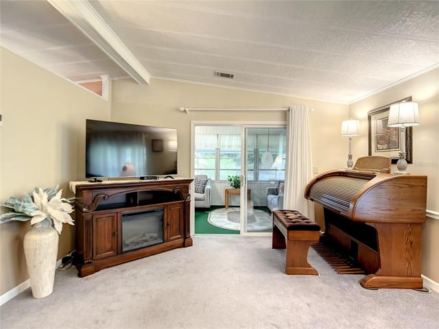 Living room and sliding doors going into the Florida room