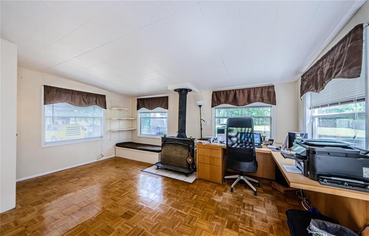 Office/den/sunroom with wood burning fireplace