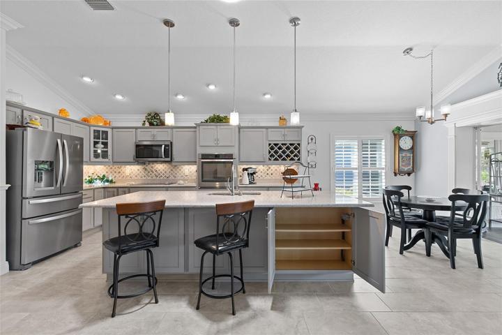 PLENTY OF CABINET SPACE!  THIS UNIQUE BREAKFAST BAR IS PERFECT FOR ENJOYING MORNING COFFEE...