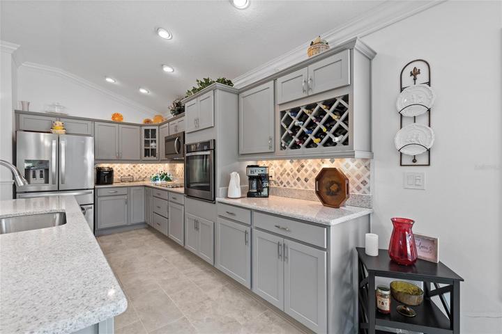 CHECK OUT THE BUILT-IN WINE RACK AND GLASS-PANED CORNER CABINET