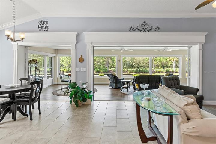 WHAT A STATEMENT THIS VIEW MAKES!  ROOM FOR ALL AND A VIEW TO THE EXPANDED FLORIDA ROOM -- THE HEART OF THE HOME!!!