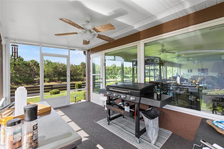 THIS SCREENED PERGOLA LANAI MAKES A GREAT OUTDOOR COOKING AREA OR CAN BE USED AS A PEACEFUL SITTING AREA