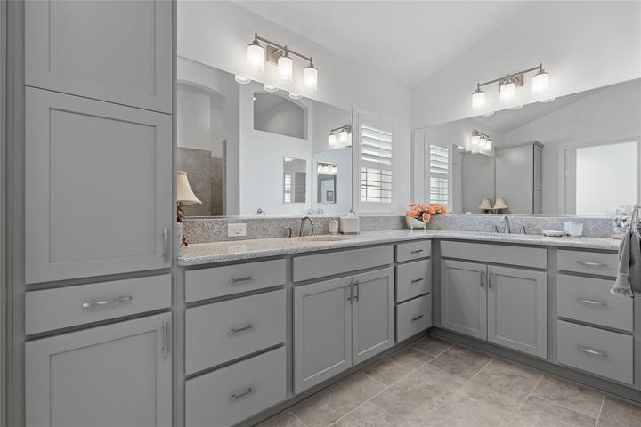 THE GORGEOUS MASTER BATH HAS DUAL SINKS AND PLENTY OF COUNTER AND STORAGE SPACE