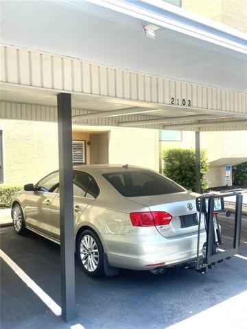 Assigned carport right adjacent to the building.
