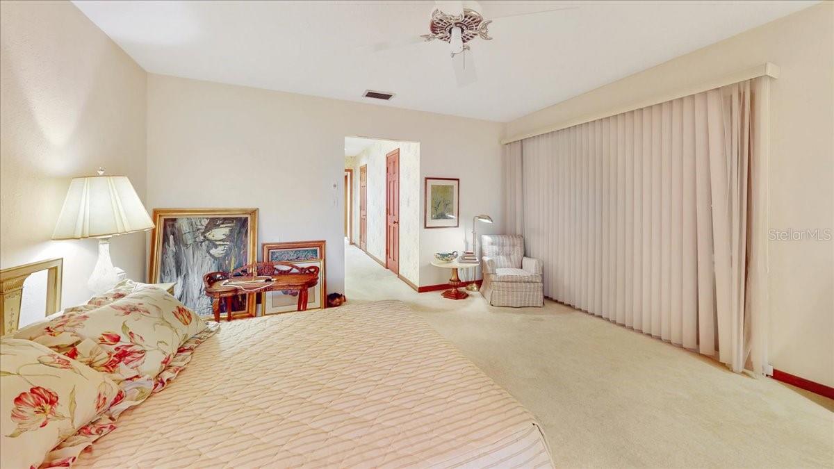 Primary bedroom. Hallway to bathroom.