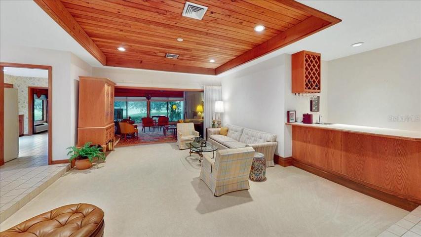Living room with a beautiful wood ceiling