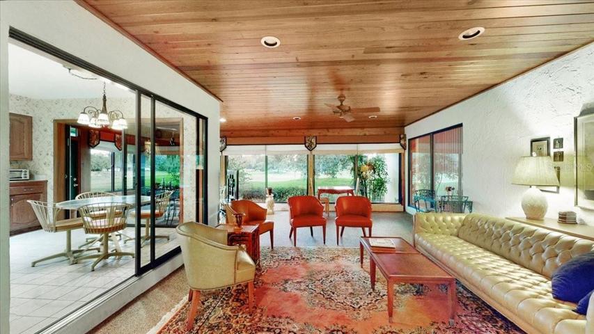 L-shaped Lanai/porch area, fully furnished. Ceiling fans and a mini split for cooling comfort