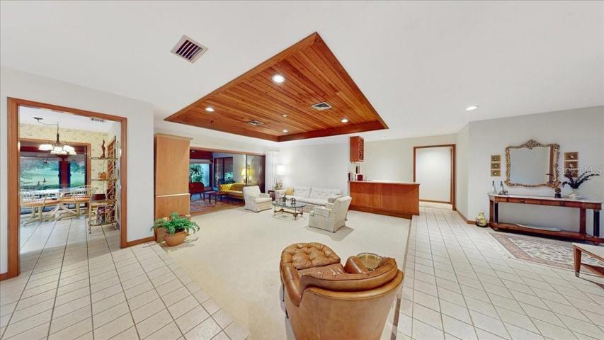 Just inside the foyer is the living room including a very .... wet bar