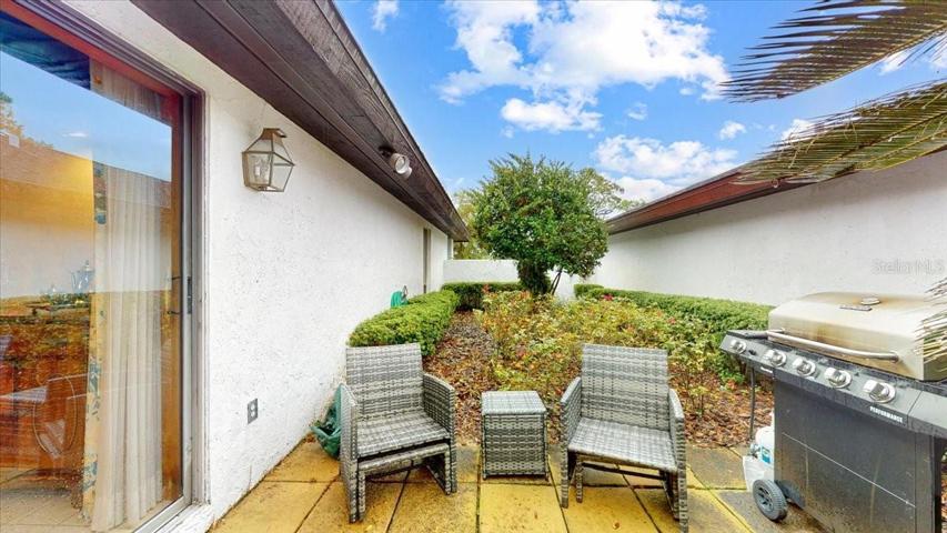 Courtyard equipt with BBQ grill and furniture