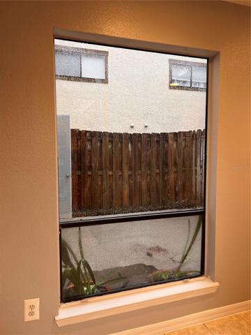 Kitchen window looking out to back patio