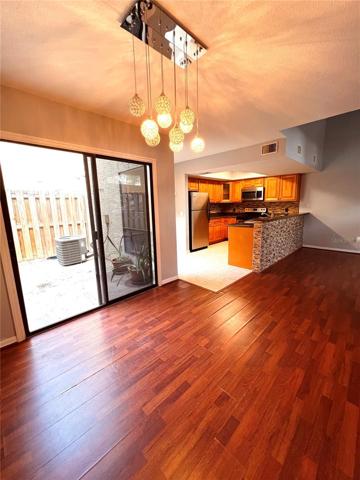 From dining room, looking out to back patio and kitchen