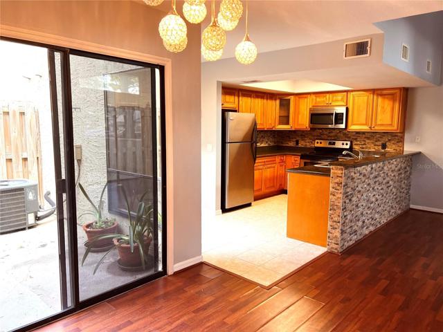 From dining room, looking out to back patio and kitchen