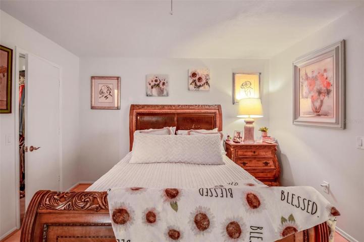 The main bedroom boasts a ceiling fan