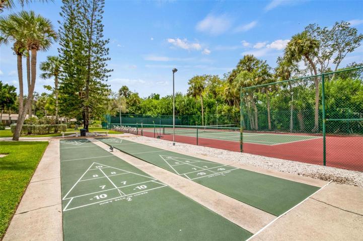 Village Gardens features a clubhouse, pool, tennis court and a shuffleboard