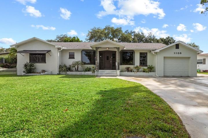 Welcome to a home with enchanting curb appeal & plenty of parking in the driveway.