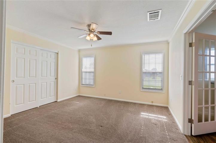 Master bedroom is oversized with walk-in closet, ceiling fan, ample space for king bedroom set.