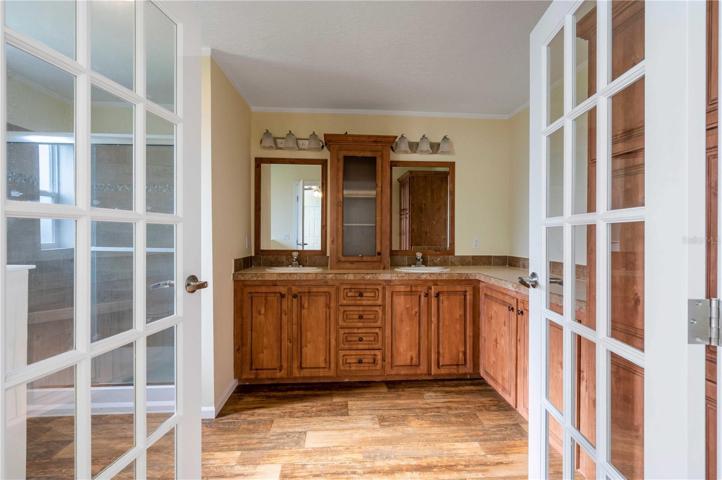 Double French doors open into this beautiful master retreat.