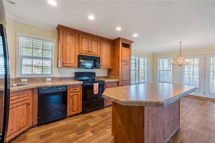 Open concept kitchen, dining, and living room.