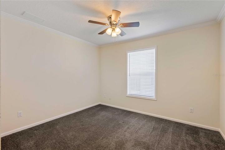 Bedroom 2 has ceiling fan, built-in closet, and carpeting.