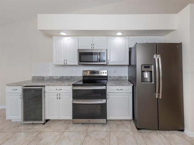 Kitchen with double oven and wine fridge