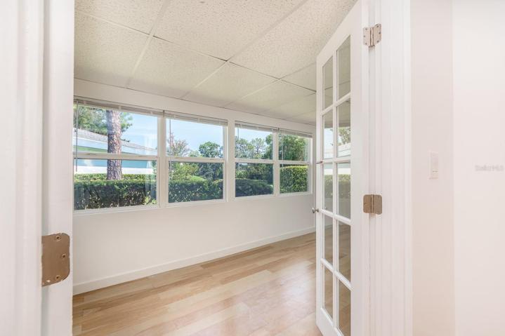 DOUBLE FRENCH DOORS LEAD TO THE HOME OFFICE FROM THE MASTER BEDROOM
