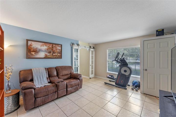flex room with a closet that could be your private office, playroom, or the 6th bedroom!