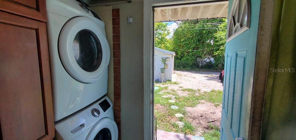 Laundry hall off kitchen to rear yard