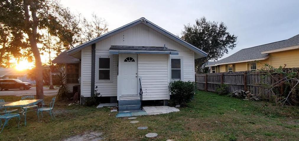Rear entrance facing 2 car garage. Alley acces.